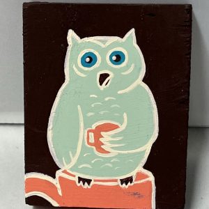 painting of an owl sitting on a tea cup