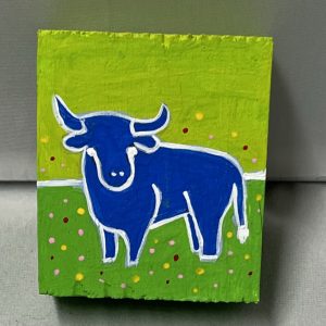 tiny painting of a bull in a field