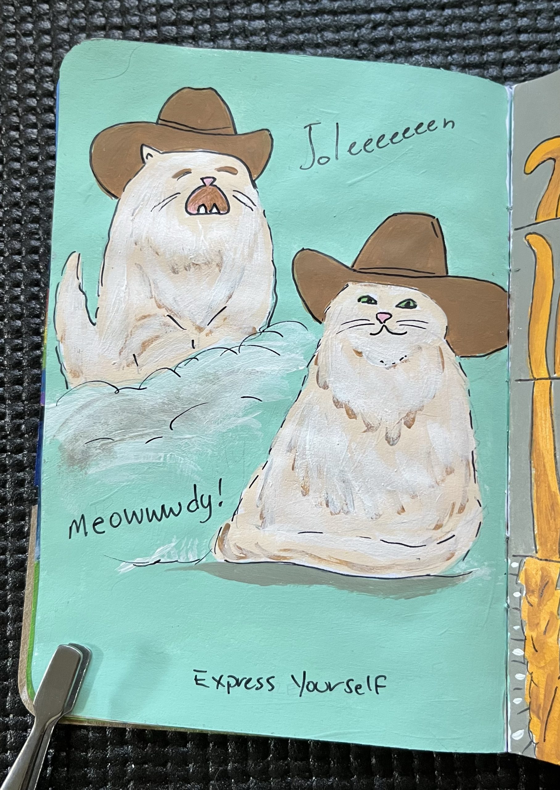 A painted page showing two cats, one is singing, the other friendly. Both are fluffy cream colored with cowboy hats.
