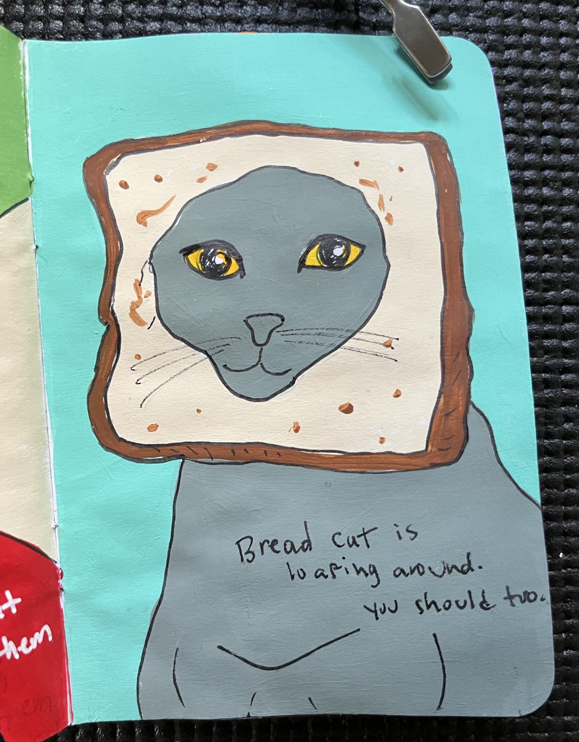 a painted page with a grey bread cat